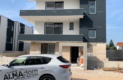 New building with 2 apartments, a pool, and a sea view. Medulin!