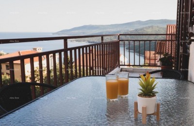 We are selling an apartment in Rabac with a sea view.