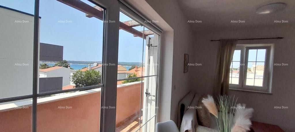 Excellent opportunity! PROPERTY WITH USAGE PERMIT. Exclusive sale of an apartment in a prime location with a garden and parking space. Sea view! Pošesi, Medulin!! 4
