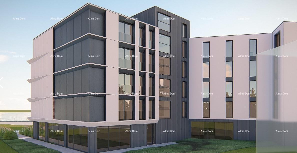 Apartments for sale in a residential and commercial building with a sea view, center of Umag! 1