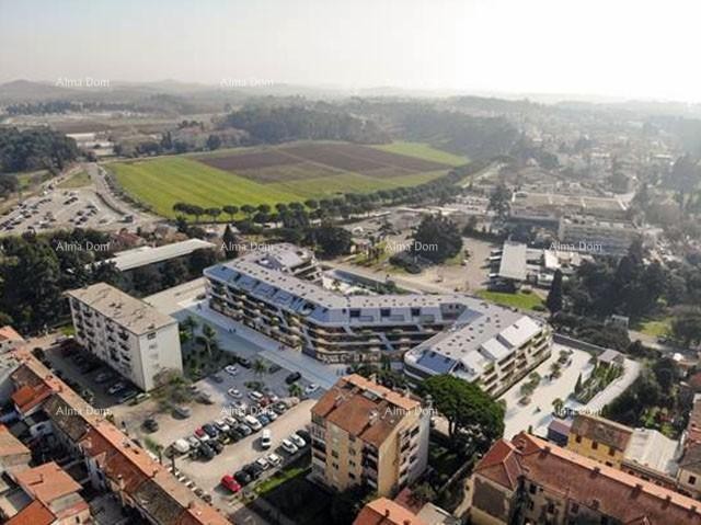 Poreč, residential and commercial building with apartments and underground garages 1