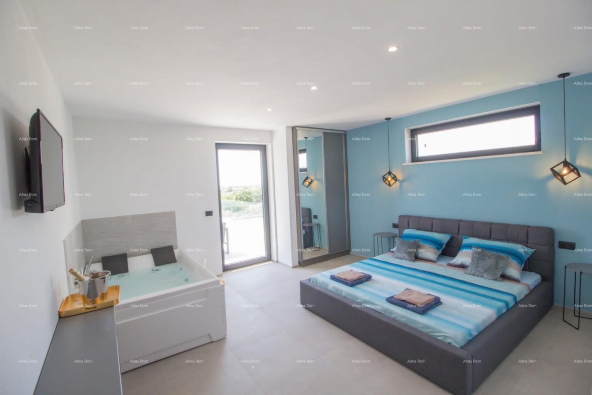 For sale is a modern and luxurious villa located in the beautiful village of Peroj 8