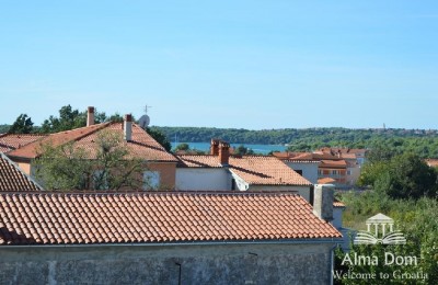 We are selling a house with five apartments in Medulin.