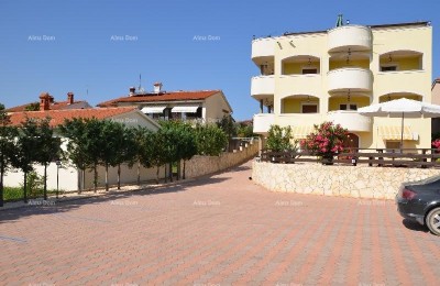 Apartment building with pool in a great location, overlooking the sea in Medulin