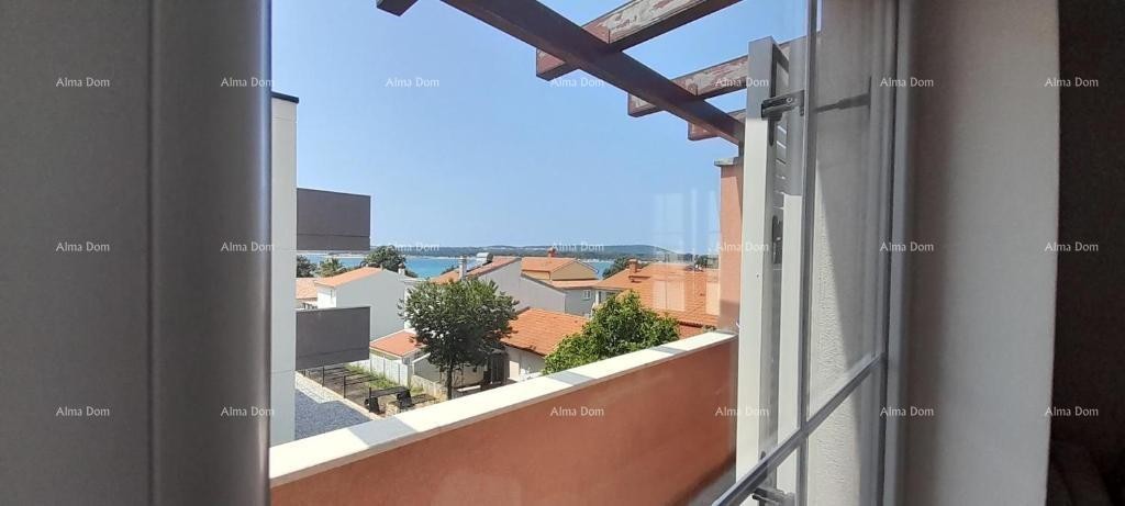 Excellent opportunity! PROPERTY WITH USAGE PERMIT. Exclusive sale of an apartment in a prime location with a garden and parking space. Sea view! Pošesi, Medulin!! 1