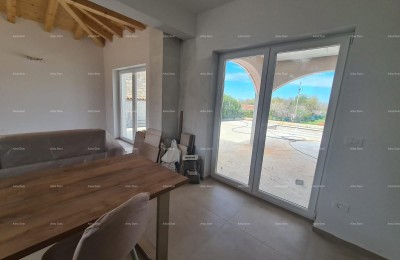 Elegant villa in a peaceful setting near the sea with views of vineyards and olive groves.